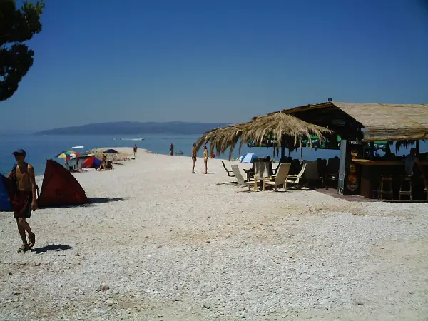 Makarska coastline with pebble beach and pine trees