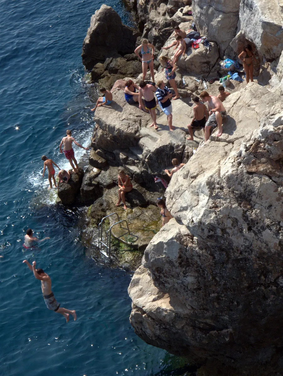 Rocky beach near Dubrovnik Old Town walls, Croatia