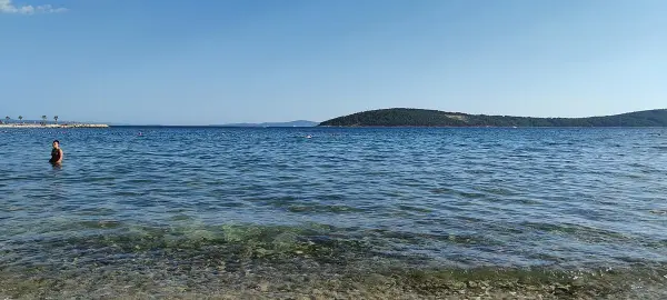 Kasjuni Beach on Marjan peninsula in Split, Croatia with clear blue water