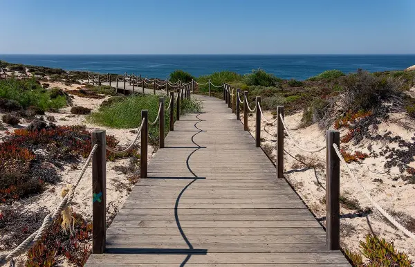 Praia da Amalia hidden beach with waterfall and dramatic cliffs on the southern Alentejo coast