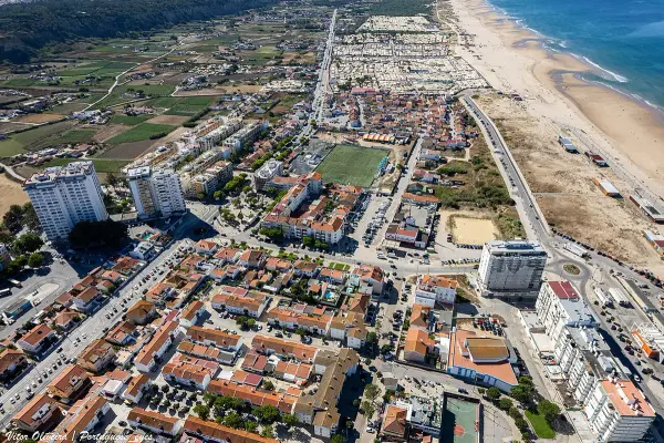 Praia da Fonte da Telha Sul expansive sandy beach popular with dog owners near Lisbon