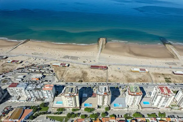 Praia da Fonte da Telha Sul expansive sandy beach popular with dog owners near Lisbon