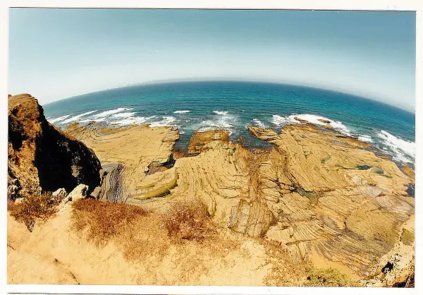Praia das Furnas beach with caves carved into limestone cliffs near Figueira, Vila do Bispo, Algarve