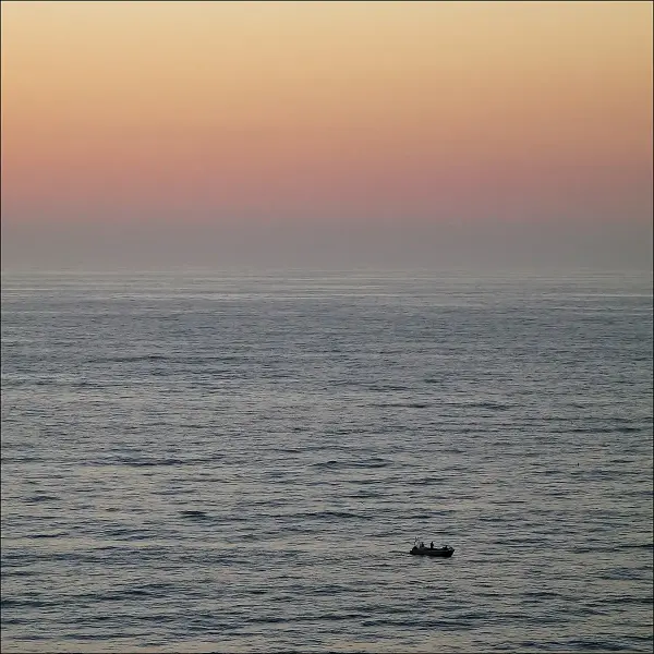 Praia de Vale Figueiras wide sandy beach backed by schist cliffs on the Algarve west coast, Portugal