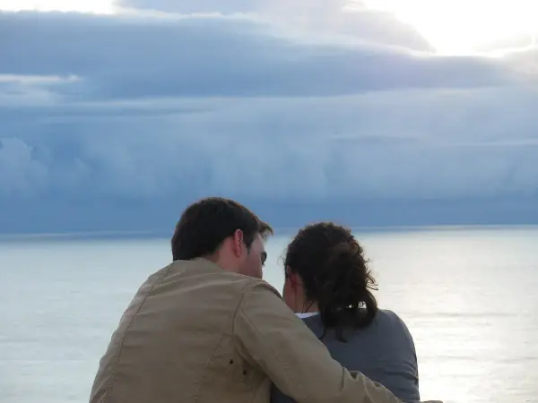 Praia do Magoito wild beach with towering cliffs in Sintra-Cascais Natural Park